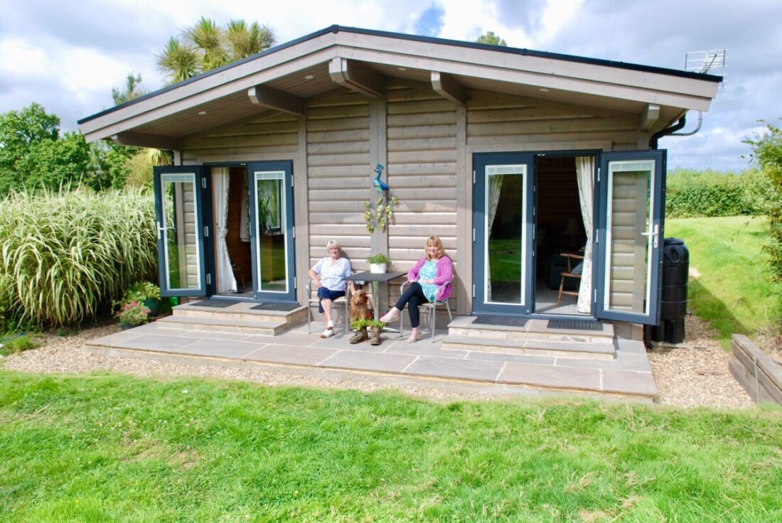 Women sitting outside annex